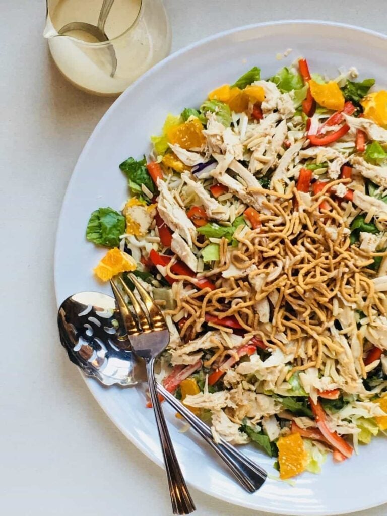 asian chicken salad all assembled on a large plate