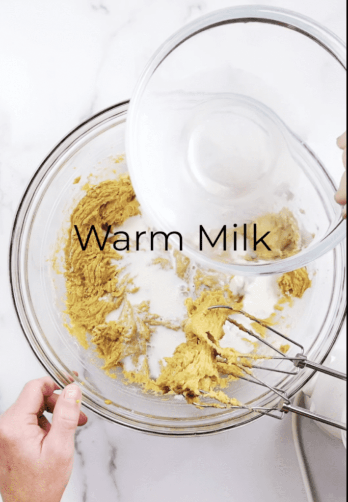 warm milk being added to pumpkin cake