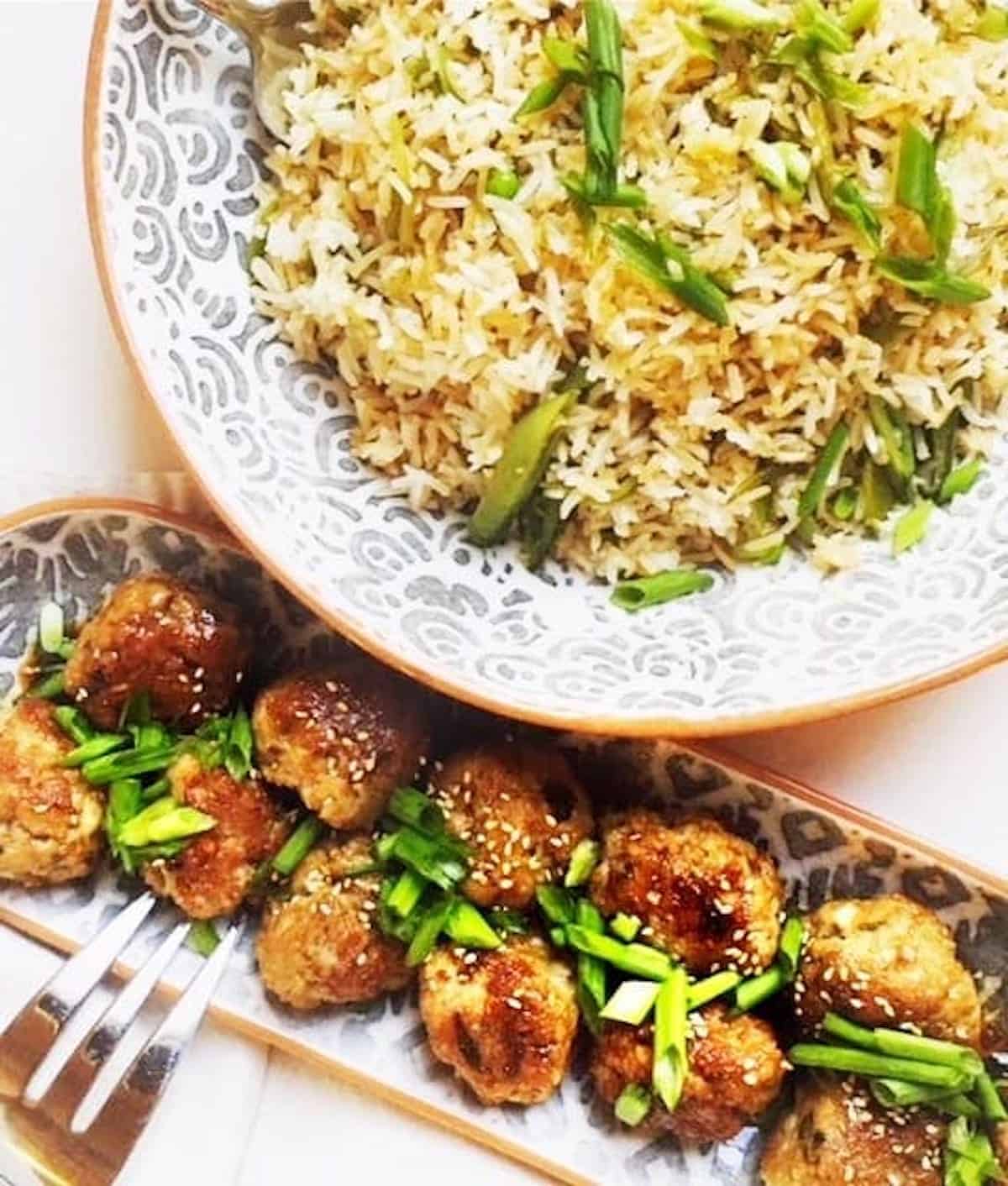 asian-meatballs on a plate with scallions on top