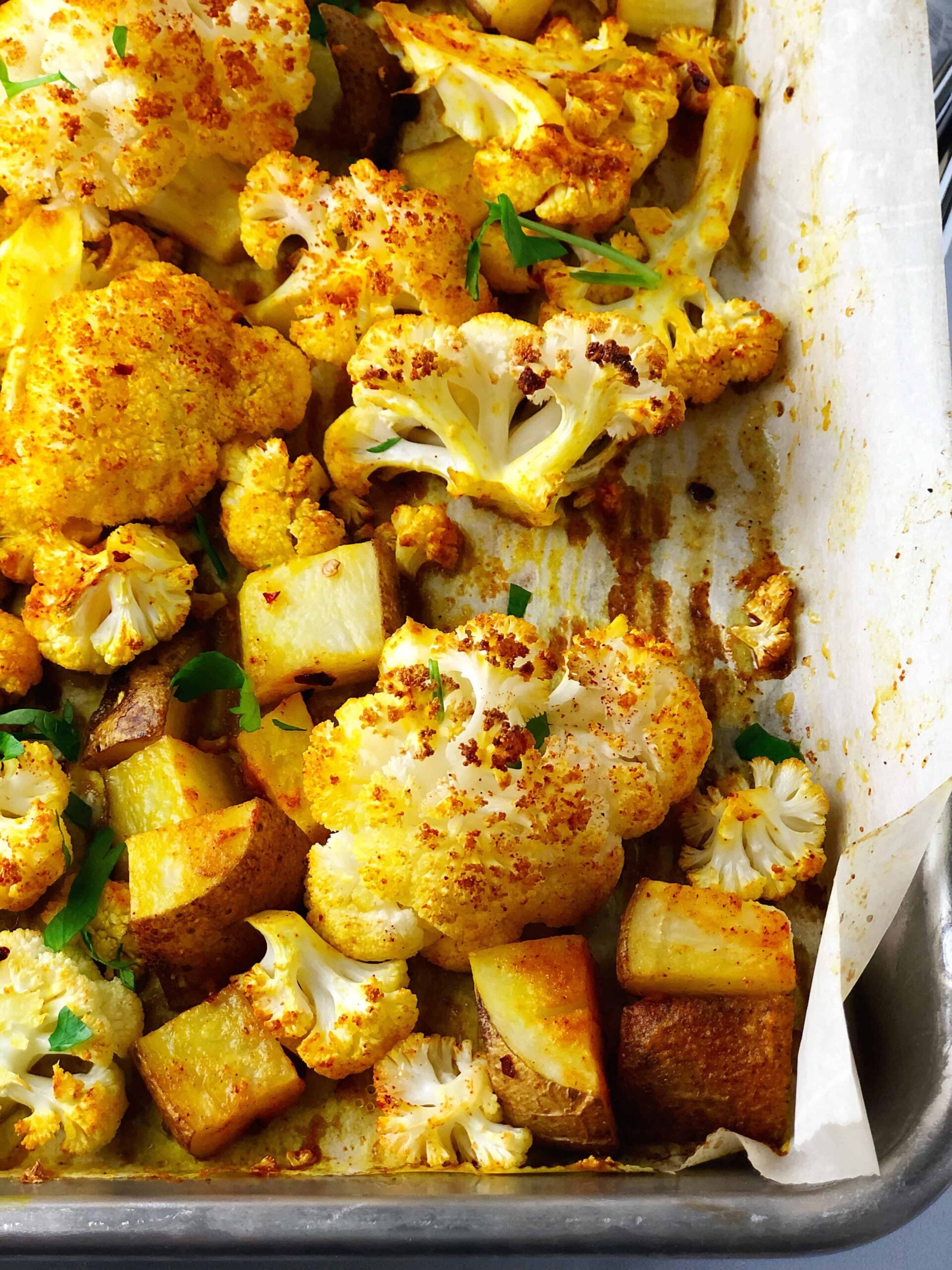 cauliflower and potatoes on a sheet pan.