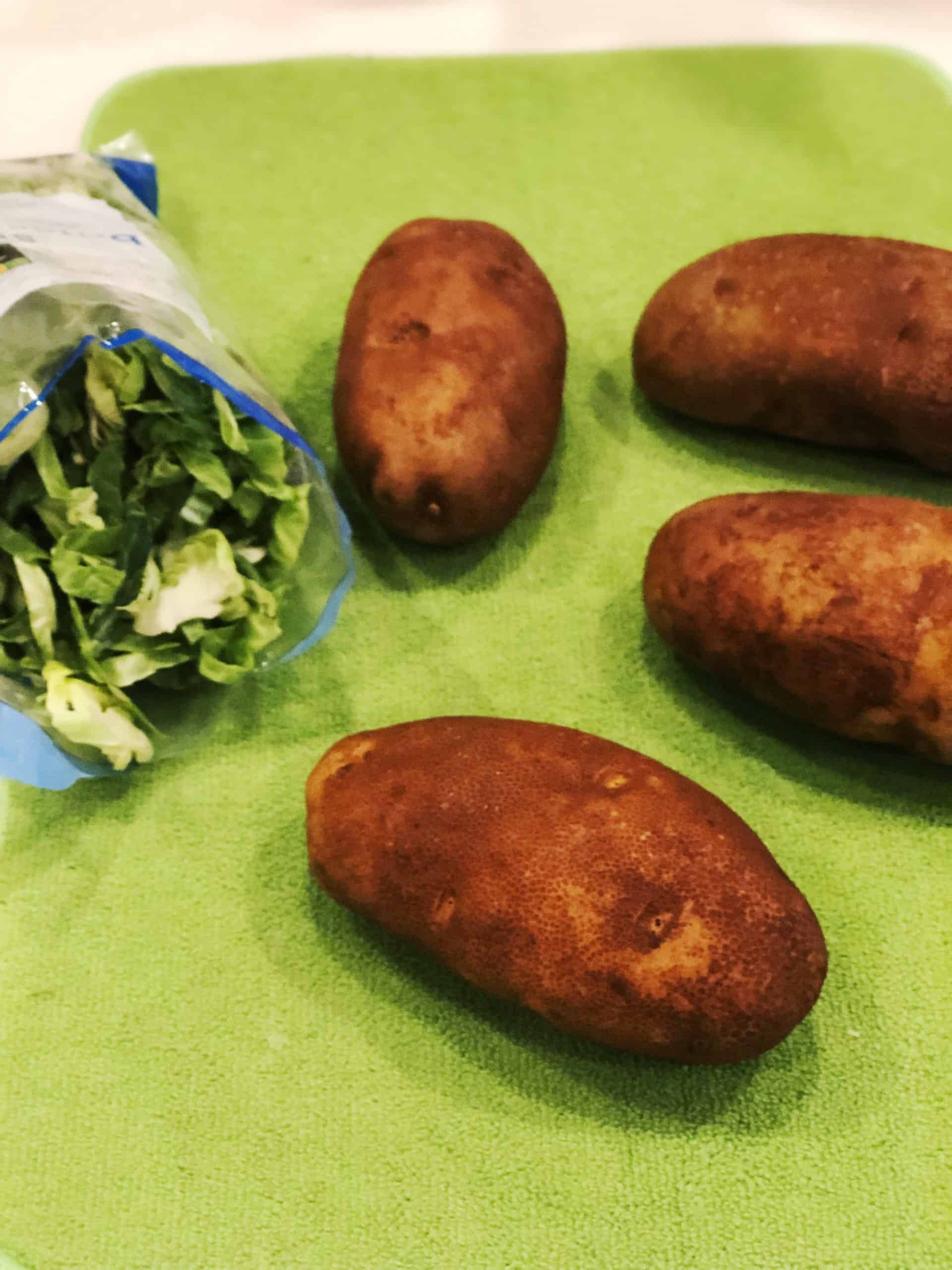 Ingredients for potato and Brussels sprouts gratin on the counter.