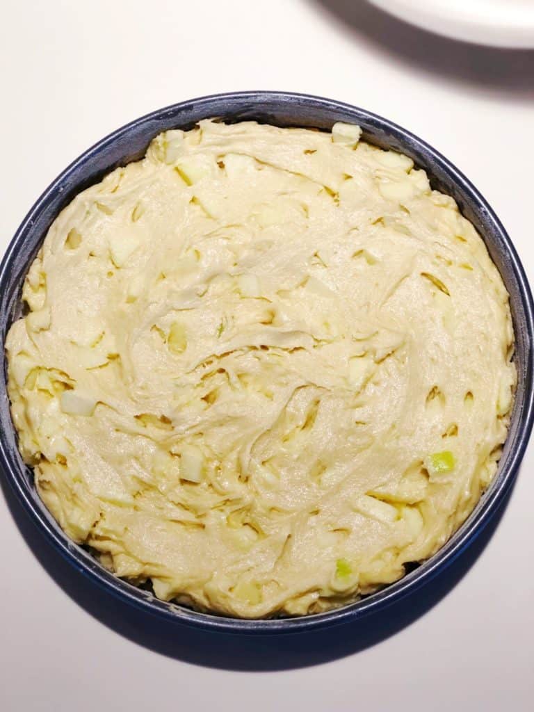 Apple cake batter in pan.
