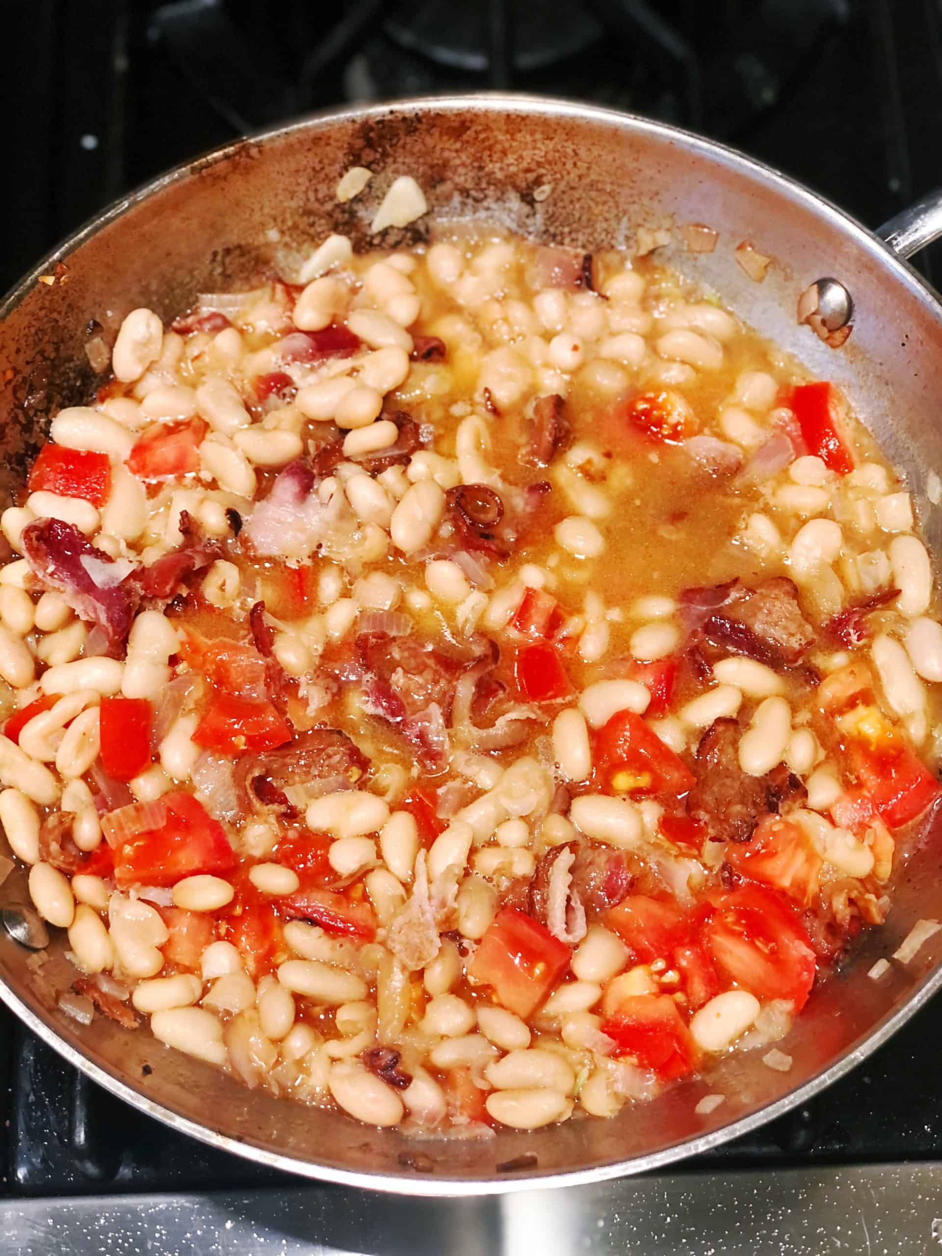 cannellini beans with pancetta simmering
