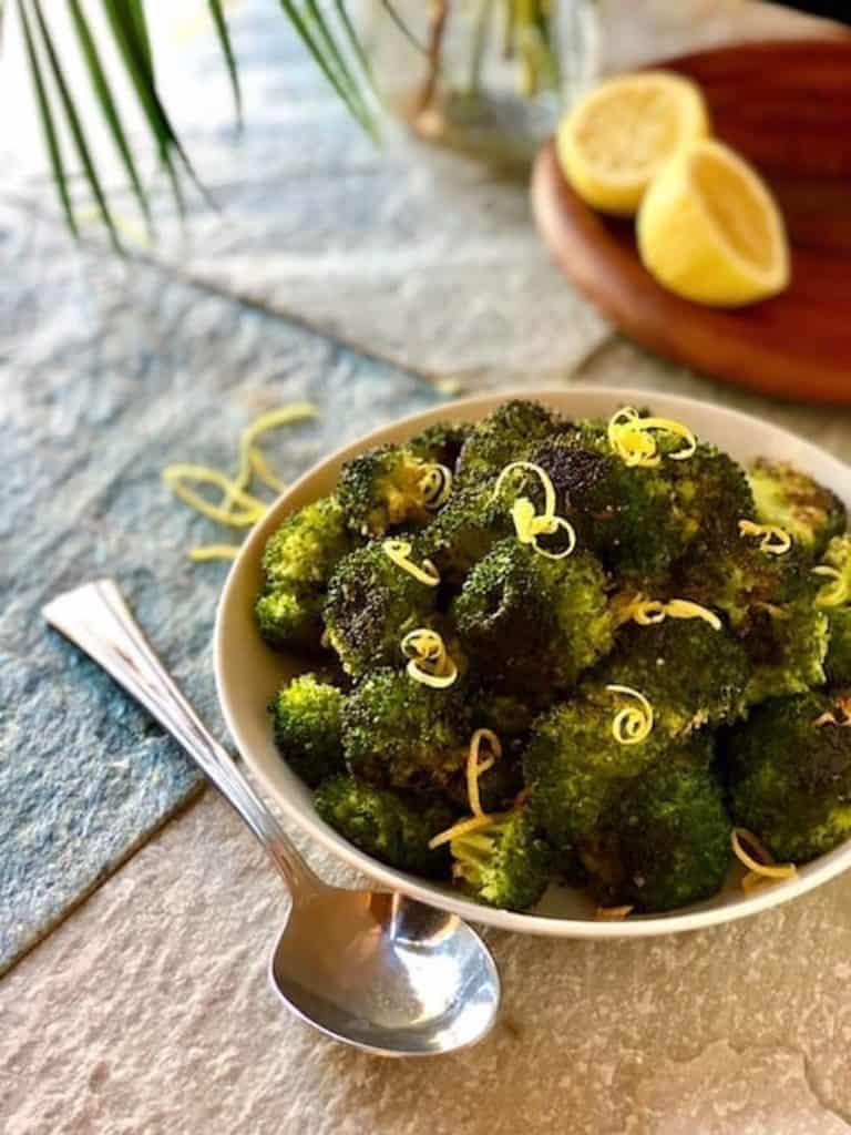 Broccoli in a bowl on the table.