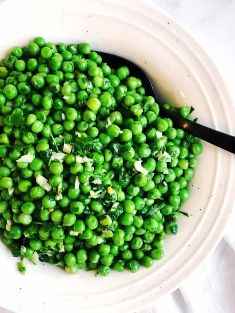 Italian Peas with garlic and parsley in bowl
