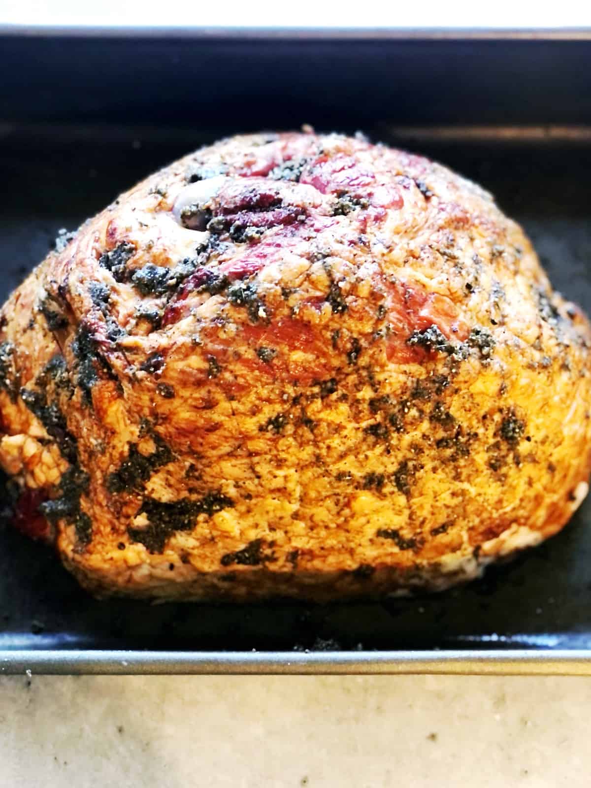 adding spices to ham