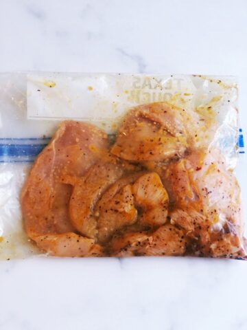 Southwest chicken bowl on a marble counter.