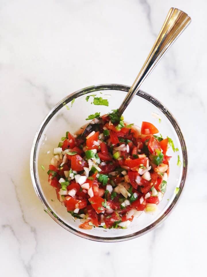 mixing the homemade pico de gallo