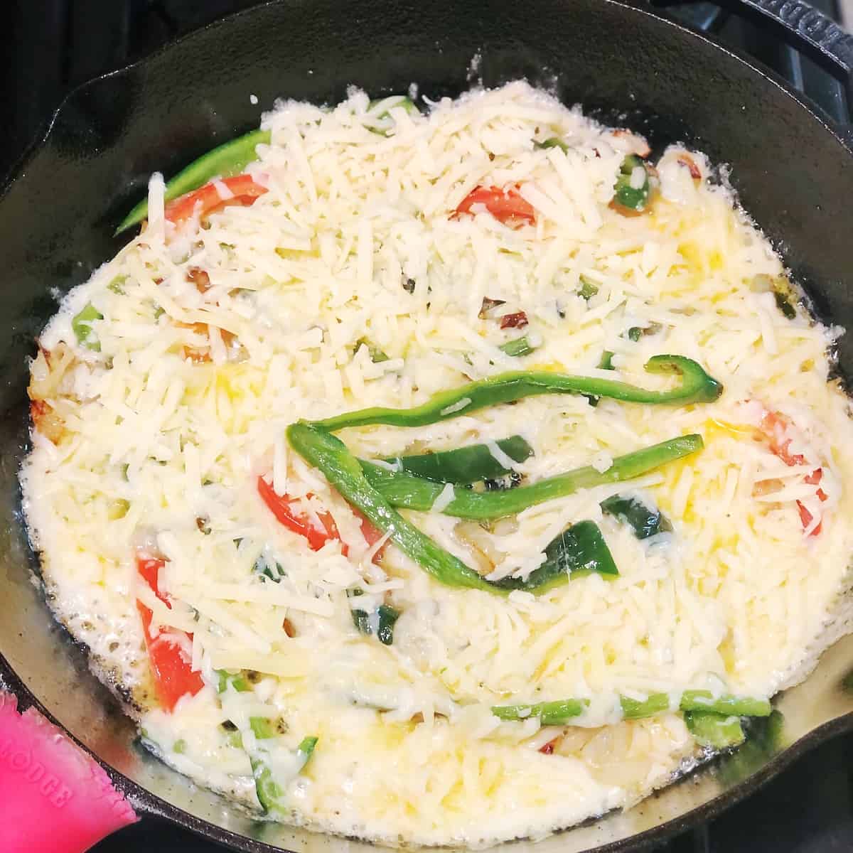 adding queso to pan