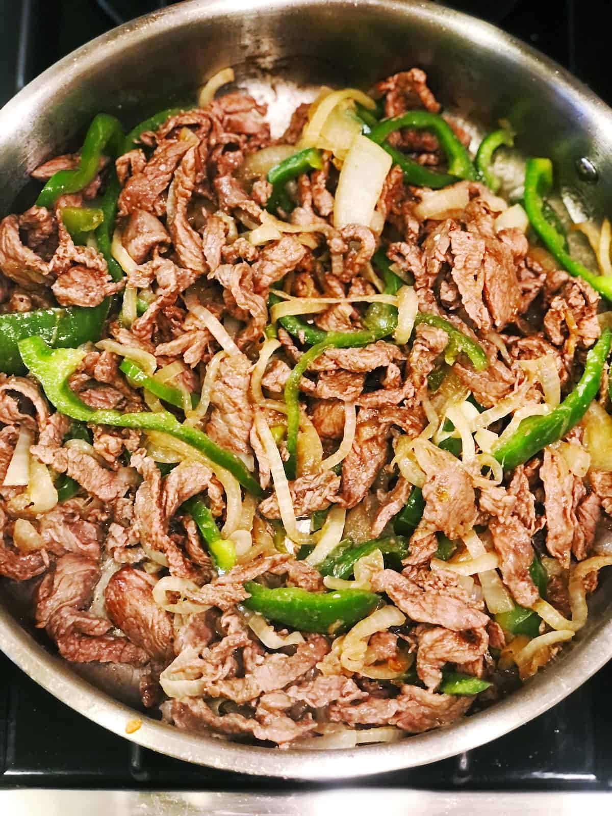 philly cheesesteak ingredients in pan