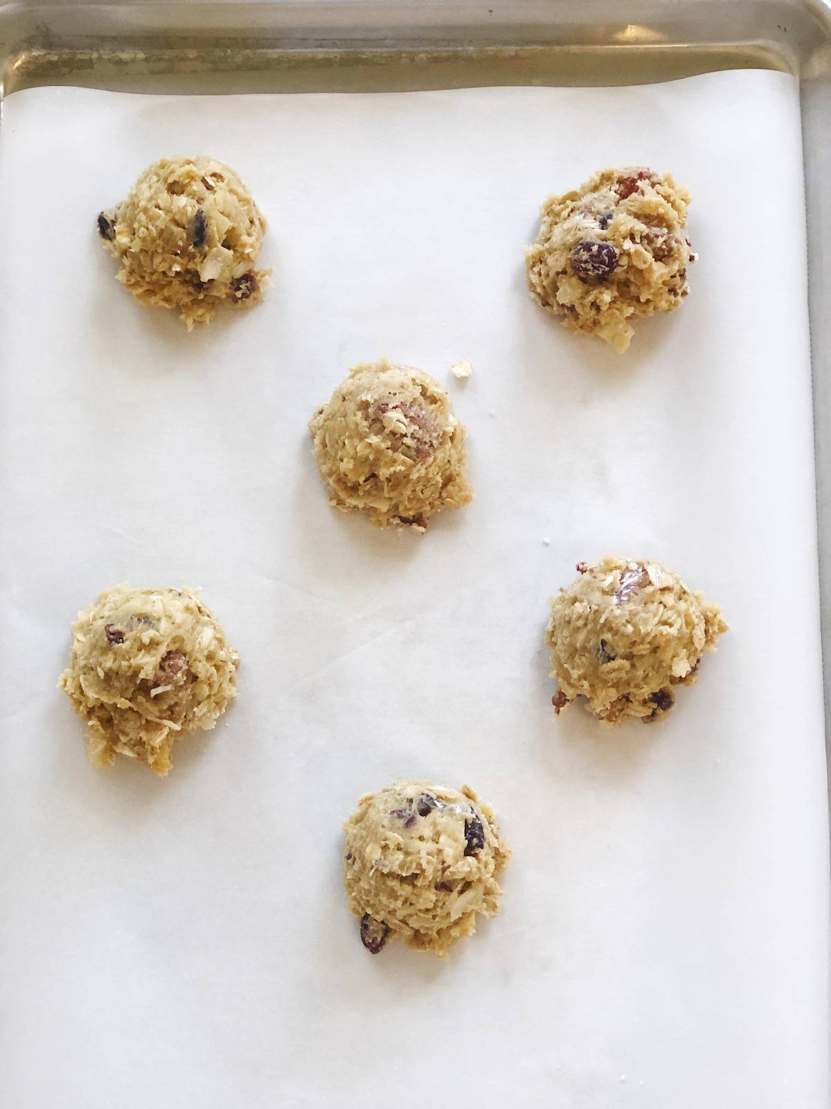 scooped cookie dough on sheet pan