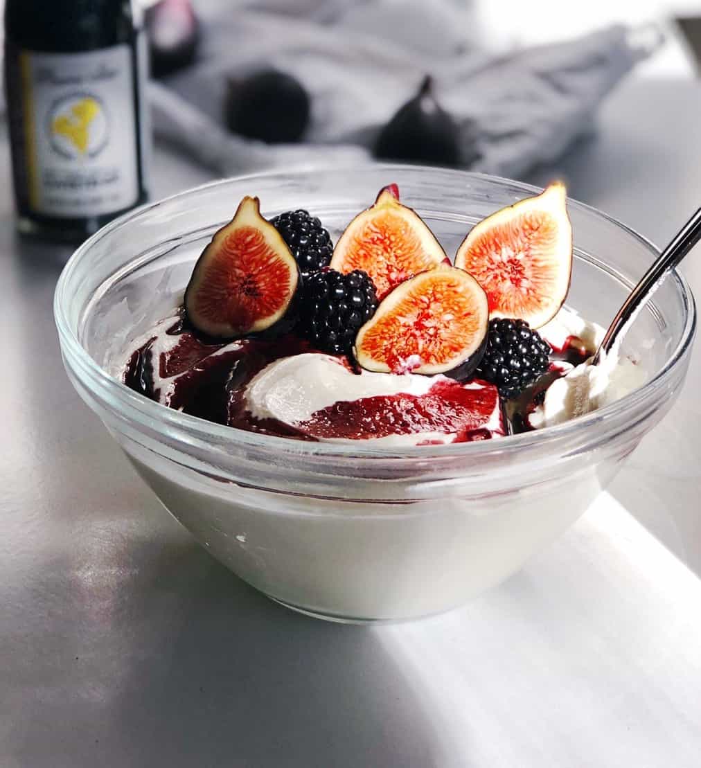 whipped cottage cheese in bowl with figs and honey topping