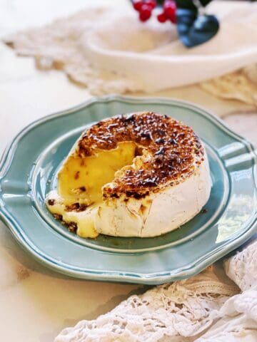 A plate with a piece of cheese on it.