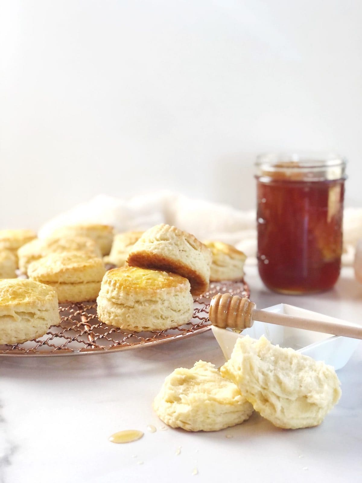 Biscuits with honey and a jar of honey.