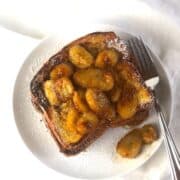 A plate of french toast with bananas on it.