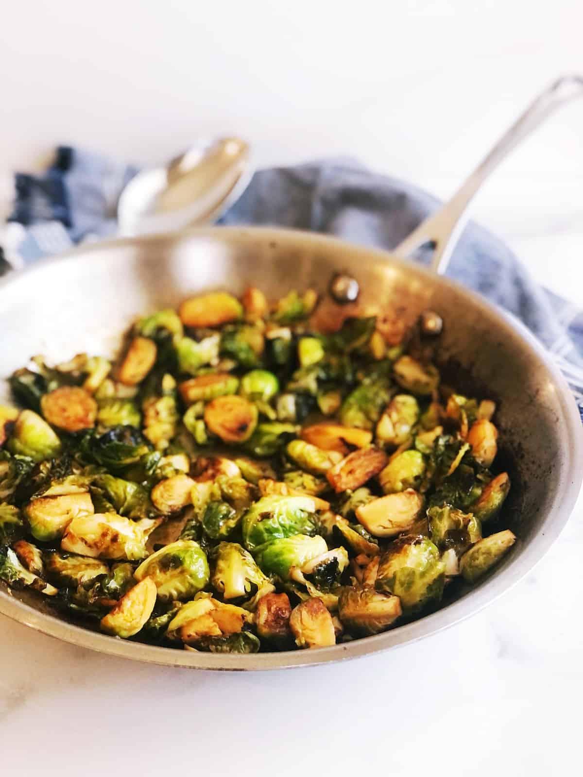 Roasted brussels sprouts in a skillet.