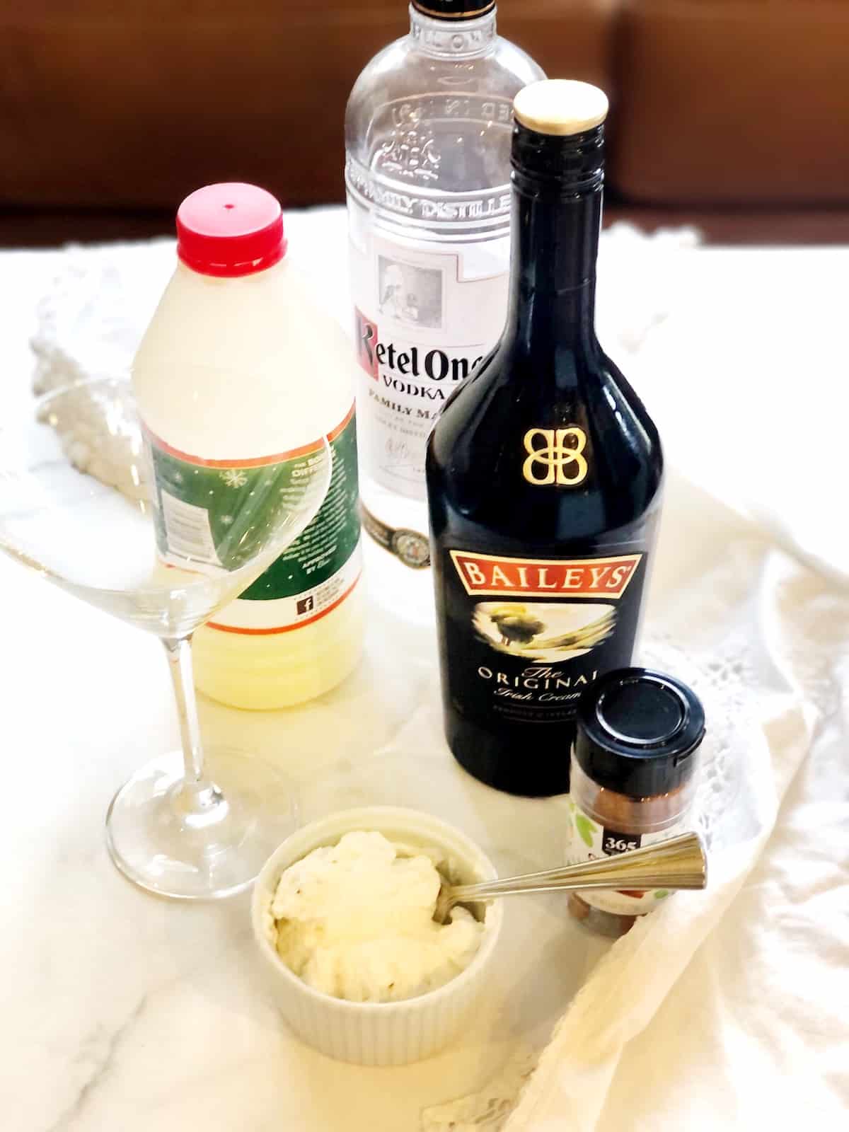 The ingredients for a bailey's eggnog cocktail.