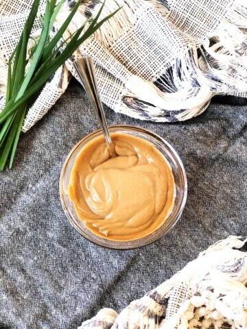 satay sauce in a bowl with a spoon.