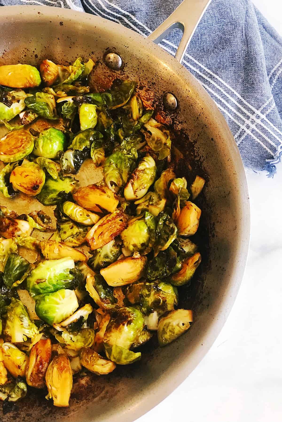 Roasted brussels sprouts in a skillet.