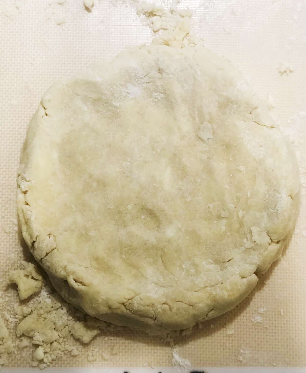 Scone dough shaped into a disc on the counter.