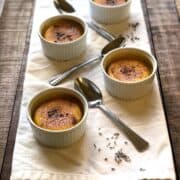 lavender creme brulee on a white napkin on a wood table