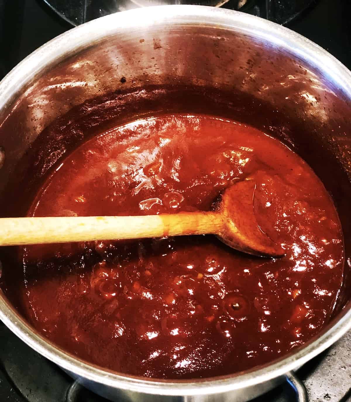 cherry BBQ sauce in. a pot on the stove.