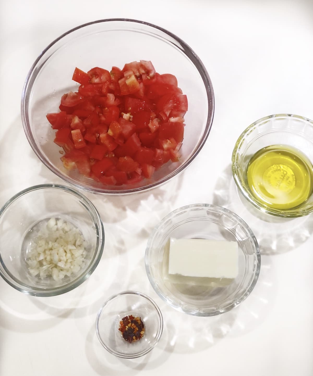 pasta with anchovy butter ingredients in prep bowls.