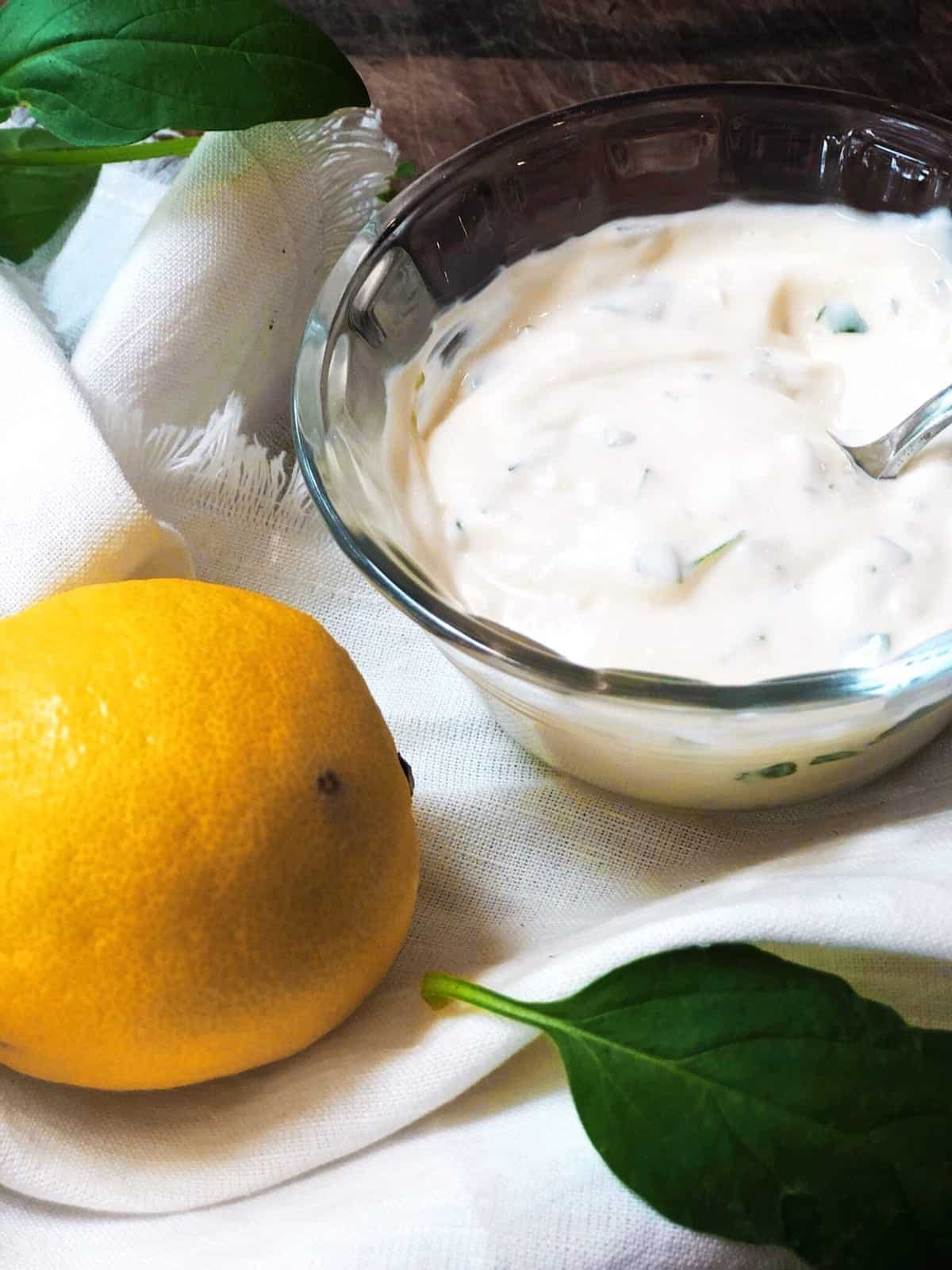 Making the basil mayo by mixing the ingredients together in a bowl.
