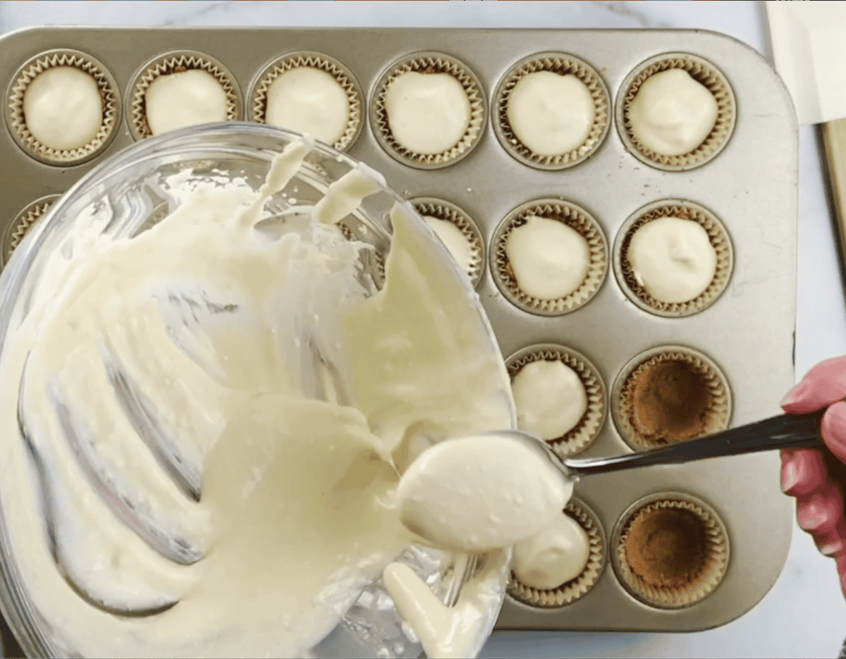 Adding Key Lime Filling To The Muffin Tin.