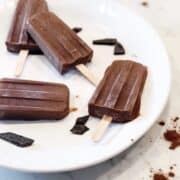 coconut milk fudge bars on a plate.