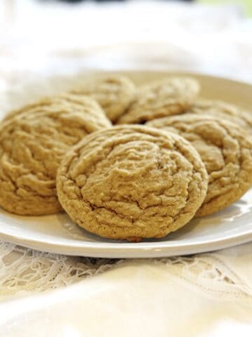 Closeup view of nutmeg sugar cookies on a plate.