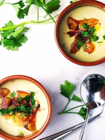 Garlic potato soup in bowls.