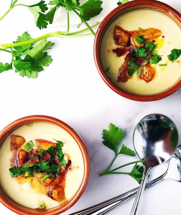 Garlic potato soup in bowls.